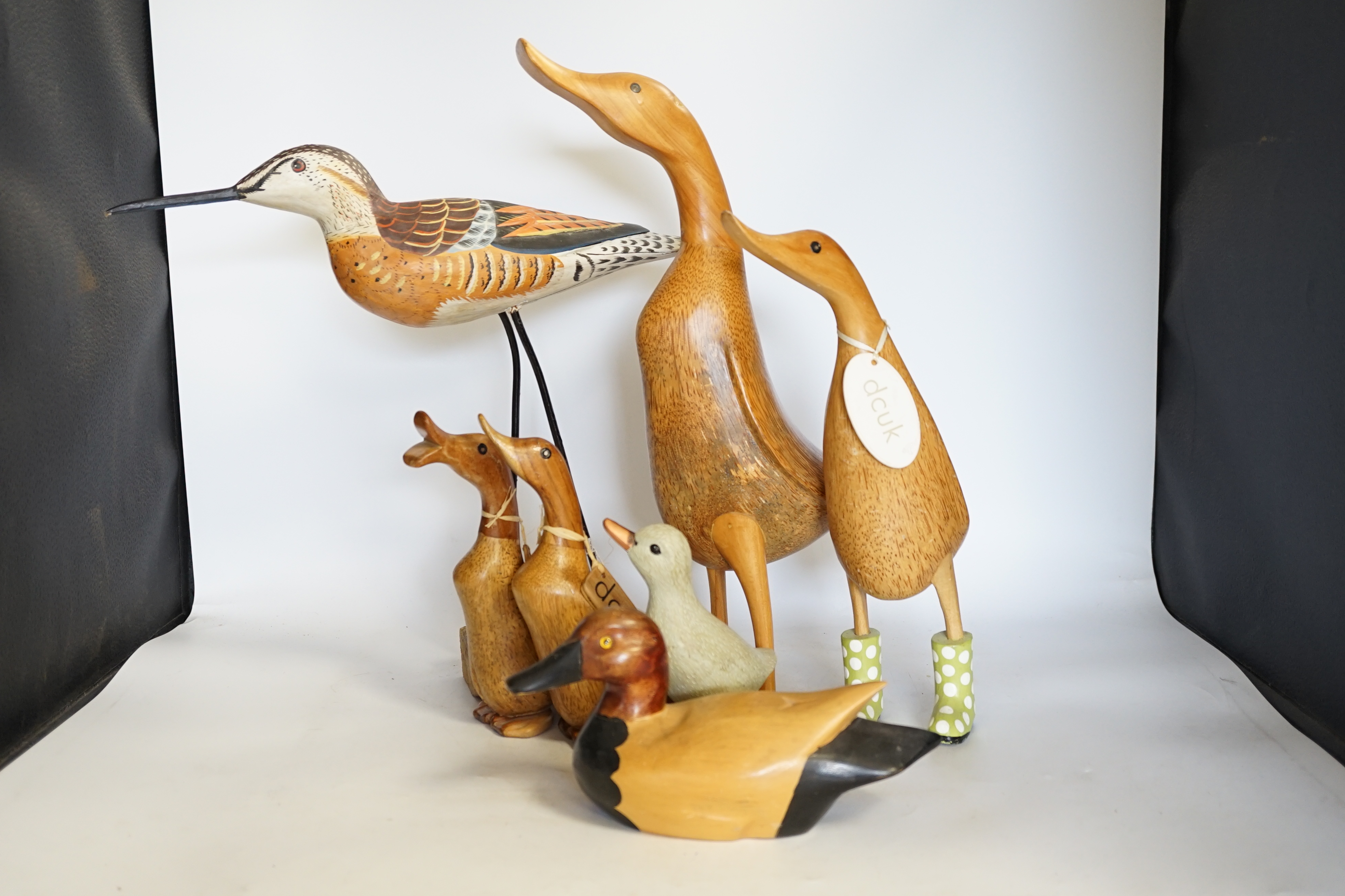 A collection of wooden painted ducks and waders
